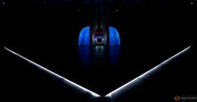 The new Bugatti Chiron car is unveiled during presentation ahead of the 86th International Motor Show in Geneva, Switzerland, February 29, 2016. The new Bugatti Chiron car is unveiled during presentation ahead of the 86th International Motor Show in Geneva, Switzerland, February 29, 2016.