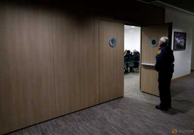 A U.N. security officer stands guard at the door of a meeting with a delegation of the High Negotiations Committee (HNC) and U.N. mediator Staffan de Mistura during Syria peace talks at the United Nations in Geneva, Switzerland, March 22, 2016. A U.N. security officer stands guard at the door of a meeting with a delegation of the High Negotiations Committee (HNC) and U.N. mediator Staffan de Mistura during Syria peace talks at the United Nations in Geneva, Switzerland, March 22, 2016.