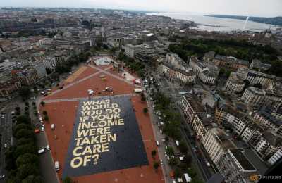 A 8,000 square meter poster is pictured on the Plainpalais square in Geneva, Switzerland May 14, 2016. The committee for the initiative for an "Unconditional Basic Income" has crowdfunded the "world's biggest poster", posing the question "What would you do if your income were taken care of ?". Swiss citizens will vote on June 5, 2016 on the proposal for an "Unconditional Basic Income". A 8,000 square meter poster is pictured on the Plainpalais square in Geneva, Switzerland May 14, 2016. The committee for the initiative for an "Unconditional Basic Income" has crowdfunded the "world's biggest poster", posing the question "What would you do if your income were taken care of ?". Swiss citizens will vote on June 5, 2016 on the proposal for an "Unconditional Basic Income".