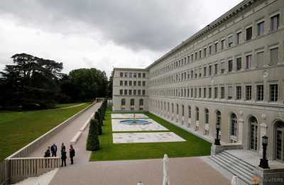 People talk outside the headquarters of the World Trade Organization (WTO) in Geneva, Switzerland, June 3, 2016. People talk outside the headquarters of the World Trade Organization (WTO) in Geneva, Switzerland, June 3, 2016.