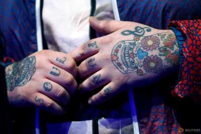 Tattoos are pictured on the hands of Rory Graham lead singer of British band Rag'n'Bone during his set at a news conference in Montreux, Switzerland, April 14, 2016. The Montreux Jazz Festival celebrates from June 30 to July 16, 2016 its 50th anniversary this year with a jubilee line-up featuring legends Van Morrison, Herbie Hancock, Patti Smith, Marcus Miller, Neil Young, Lana Del Rey, Jamie Cullum, Santana and Deep Purple. Tattoos are pictured on the hands of Rory Graham lead singer of British band Rag'n'Bone during his set at a news conference in Montreux, Switzerland, April 14, 2016. The Montreux Jazz Festival celebrates from June 30 to July 16, 2016 its 50th anniversary this year with a jubilee line-up featuring legends Van Morrison, Herbie Hancock, Patti Smith, Marcus Miller, Neil Young, Lana Del Rey, Jamie Cullum, Santana and Deep Purple.