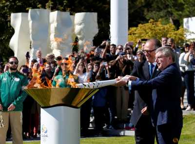 President of the International Olympic Committee (IOC) Thomas Bach (R) lights the Olympic cauldron with Carlos Arthur Nuzman, President of the Rio 2016 Organizing Committee, in front of the Olympic Museum in Lausanne, Switzerland April 29, 2016. President of the International Olympic Committee (IOC) Thomas Bach (R) lights the Olympic cauldron with Carlos Arthur Nuzman, President of the Rio 2016 Organizing Committee, in front of the Olympic Museum in Lausanne, Switzerland April 29, 2016.