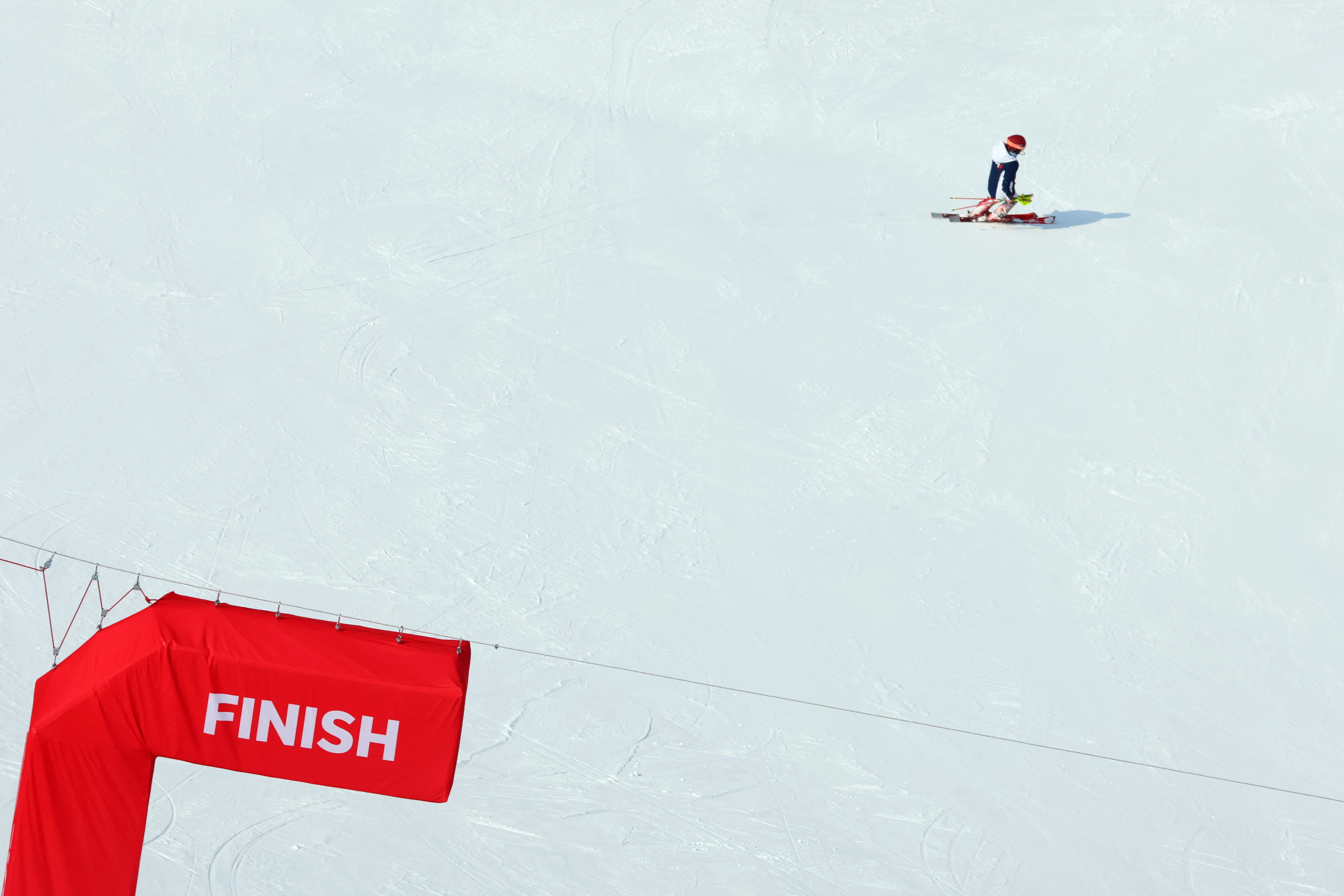 2022 Beijing Olympics - Alpine Skiing - Women's Slalom Run 1 - National Alpine Skiing Centre, Yanqing district, Beijing, China - February 9, 2022. Mikaela Shiffrin of the United States skis away after not finishing her run. REUTERS/Denis Balibouse