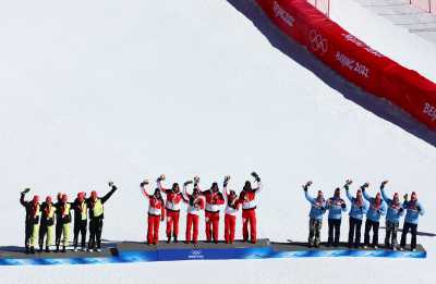 2022 Beijing Olympics - Victory Ceremony - Alpine Skiing - Mixed Team Parallel - National Alpine Skiing Centre, Yanqing district, Beijing, China - February 20, 2022. Gold medallists Katharina Huber of Austria, Katharina Liensberger of Austria, Katharina Truppe of Austria, Stefan Brennsteiner of Austria, Michael Matt of Austria and Johannes Ewald Strolz of Austria, silver medallists Emma Aicher of Germany, Lena Duerr of Germany, Julian Rauchfuss of Germany, Alexander Schmid of Germany and Linus Strasser of Germany and bronze medallists Mina Furst Holtmann of Norway, Thea Louise Stjernesund of Norway, Maria Therese Tviberg of Norway, Timon Haugan of Norway, Fabian Wilkens Solheim of Norway and Rasmus Windingstad of Norway celebrate on the podium during the victory ceremony. REUTERS/Denis Balibouse